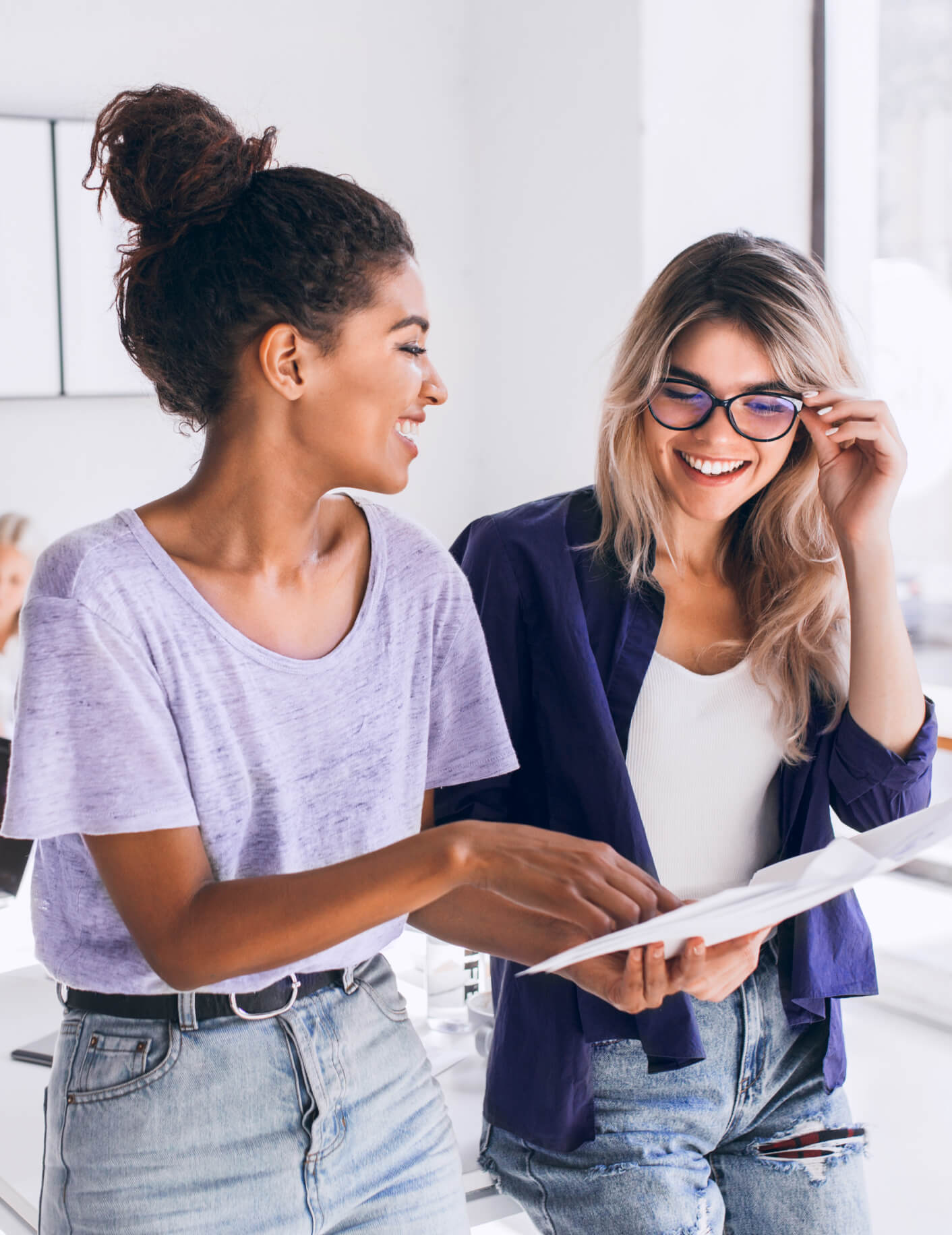 Two people discussing and looking at a document